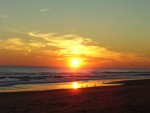 Sunset on the NC coast. Yes I know we are on the east coast and the sun sets in the west.  The beach runs east and west here so in the winter the sunrise and sunset are over the ocean.