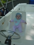 Here is Lana Rose at the helm of the "Lana Rose". That's right, I named the boat after my daughter.