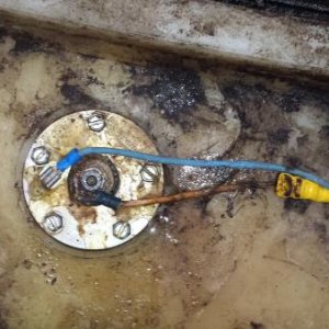 On top of fuel tank