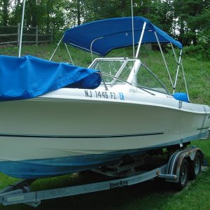 Here she is in my back yard. My father-in-law and I just removed the "Wellcraft" on the port side with a hair dryer. Came off rather easy.