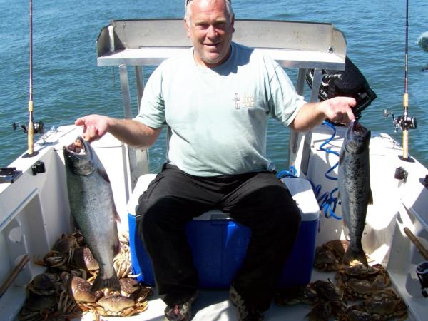 Ilwaco 09 Cousin Tom happy as can be--check out all the Dungess crab on the floor.