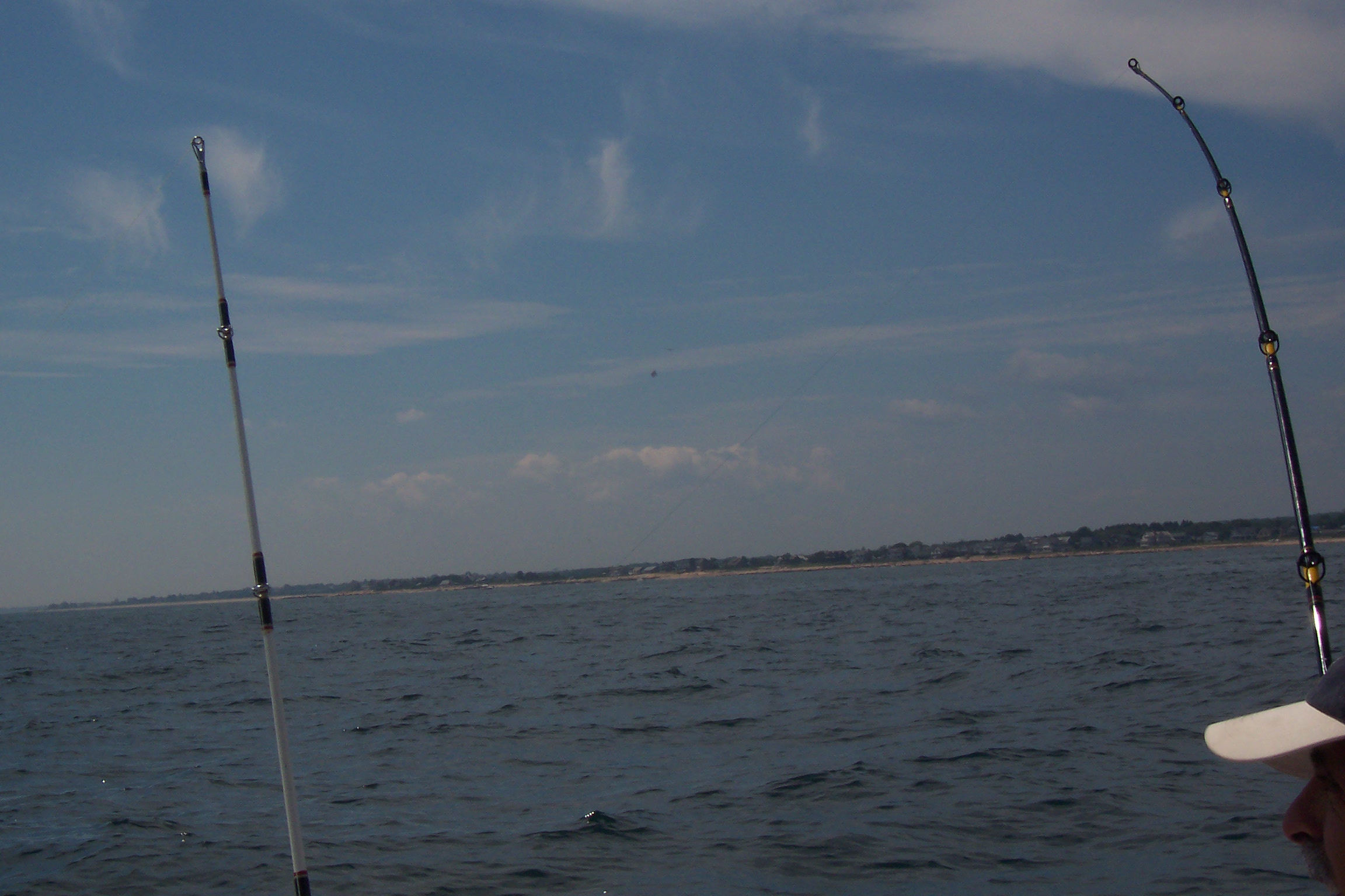 notice the rod on the right is bent and Larry didn't know he had a fish on. LOL